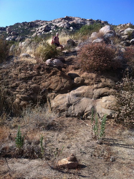 The elusive trailhead. Note the cairn at the bottom of the screen. Several hundred feet past the gate on the right.