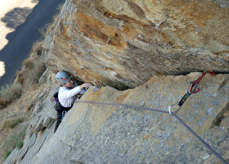 A fun variation to The Good, the Bad & the Ugly is to climb the first 6 bolts of that route and then veer right upon reaching the overhang. It is possible to follow a right-arching hand crack up to the top of the wall. <br>
<br>
The crux of this variation involves delicate smearing with a cam below your feet. Carry two pieces in the 1/2" to 1" range. Rappel from bolts.