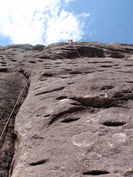 Drilling the bolt in the final crux.