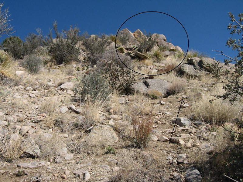 Photo was taken at a switchback and is about as close as the trail gets to the destination. The practice area is at the base of the circled formation, out of sight around to the right.