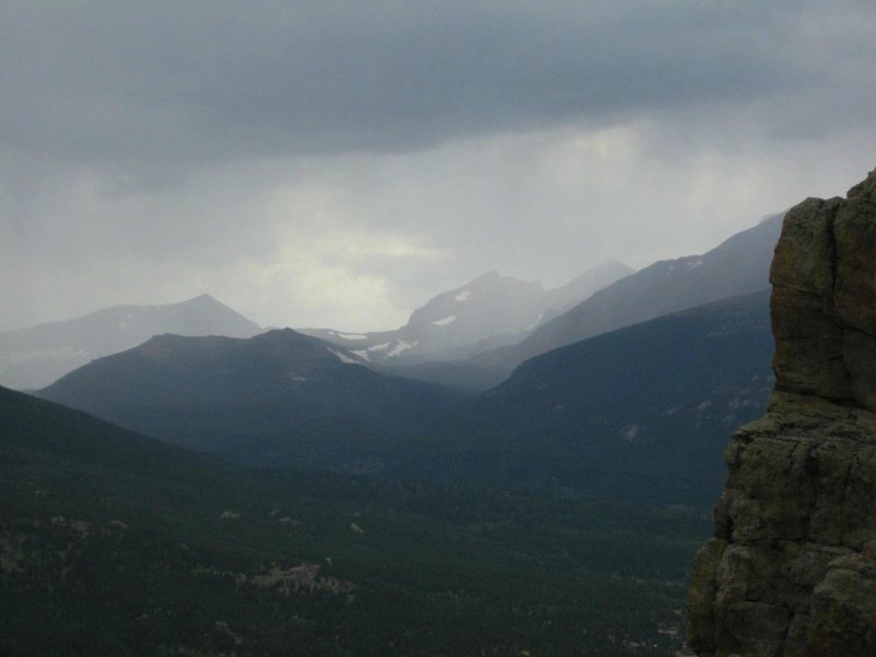 Storms moving in over Zappa's Tooth. The outline of Mt. Alice and the summits of Chiefshead and Pagoda visible in the distance.