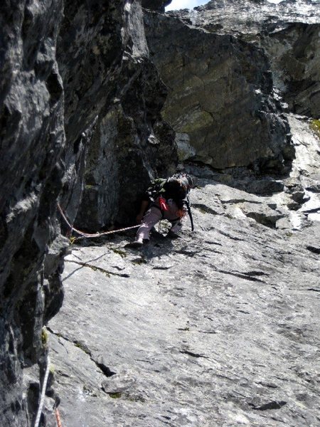 Obadiah climbing the cracks leading to the small alcove right of Lunch Ledge