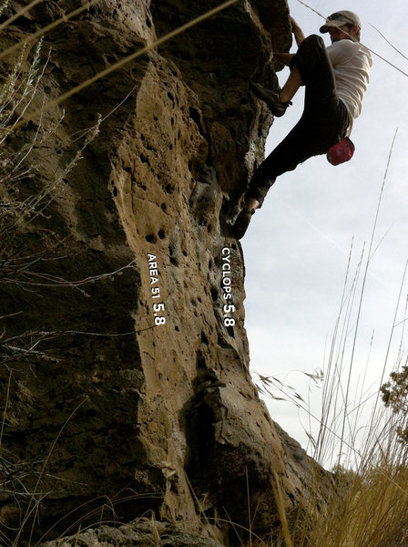 Working feet up, getting ready to reach up to big holds to pull up & over the roof/bulge. One of the few overhanging, though for just one move, at The Drive In. Fun, quick problem.
