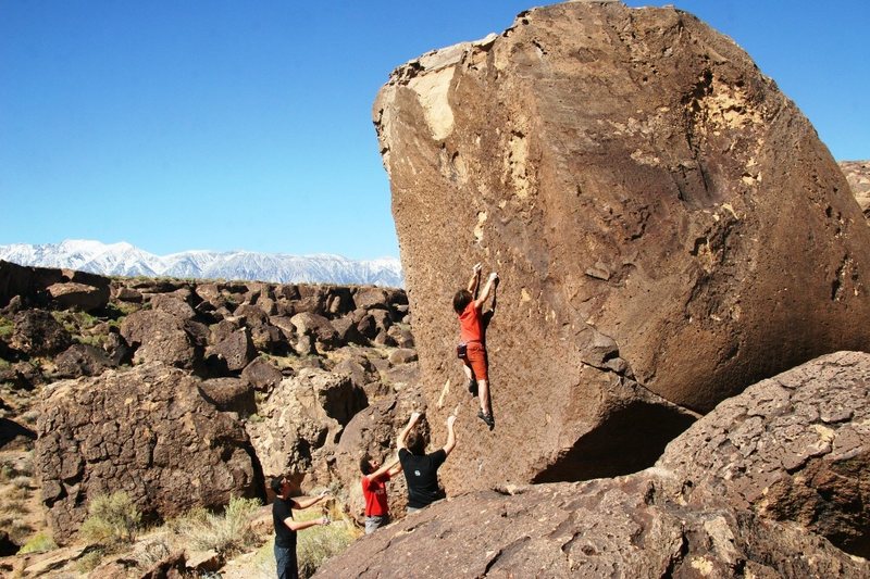 Starting the crux sequence of Black Magic, V3