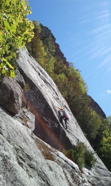 Climber in the crux of the route