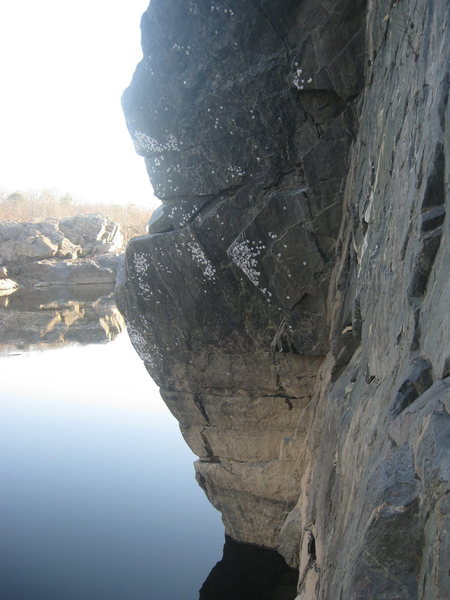 Crux 2nd pitch (5.9). Moving out left over water and onto ledge for belay.
