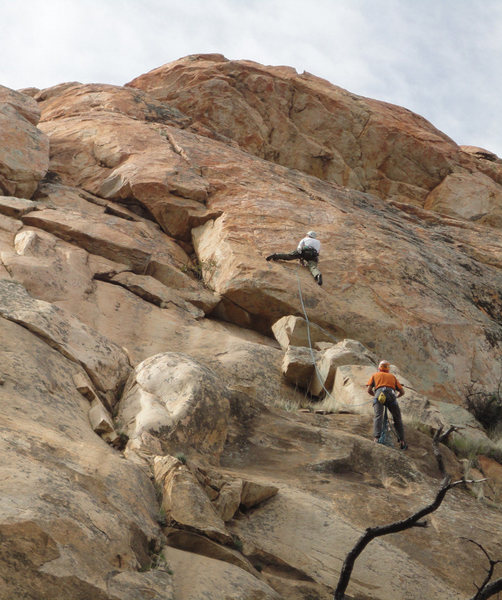 Climber is just just past a crux on P2 of Unfinished Business. The headwall looms above.<br>
<br>
Photo by Chris Hubbard.