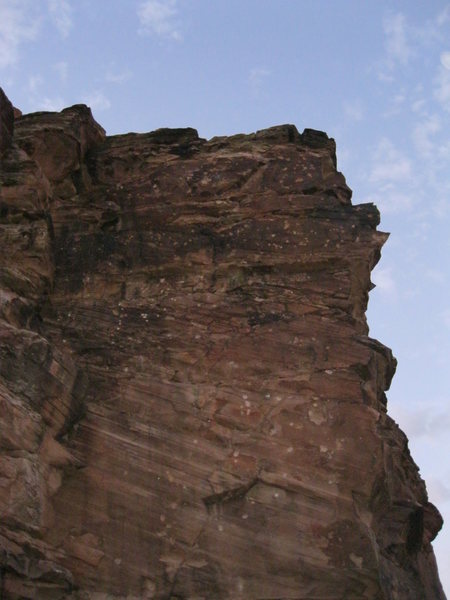Sport climb at The 5 Mile Draw, North eastern AZ. All the white dots on the rock are bullet holes or scars.