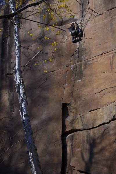 Tyler enjoying another creative and playful rest on his newly bolted climb, Nexus.