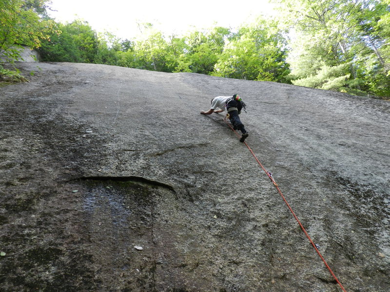 Jonathan climbs past the crux on Elvis is in the House. The eyebrow of rock can be seen on the left.