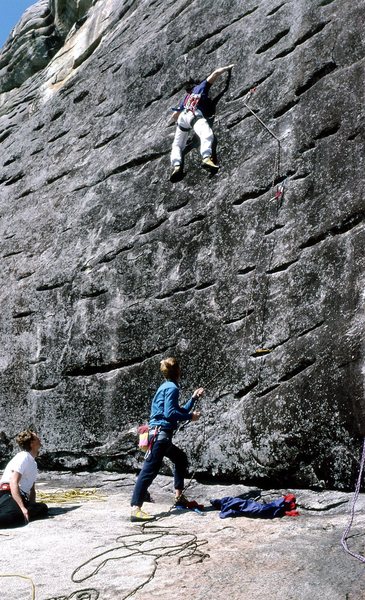Whitney H. on lead with Jeff L. belaying and Monty on Guard, FA 1987.