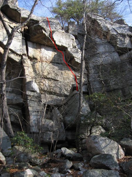 Core Shot (line). Also visible is "Shotty Not", the squeeze offwidth that starts at the right side of the boulder pile and ends at the pine tree (5.5 or 5.6).