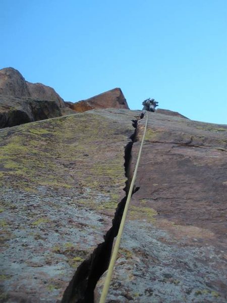Pull the roof to hands, wide hands, fists, offwidth. Pitch 5. It doesn't get much better than this. (note, picture taken by 2nd follower, climber above is 1st follower who has alreay cleaned gear. This is not a picture of the leader running it out.)