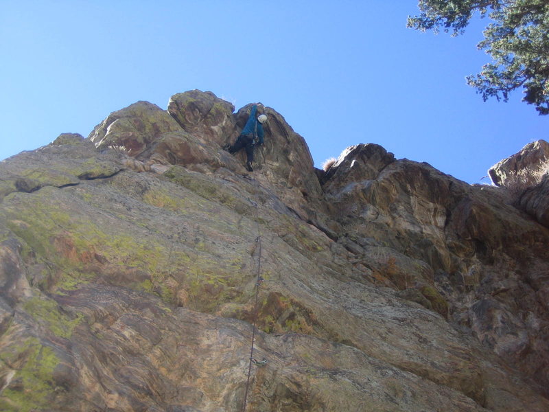 Upper crux moves at top overhang.