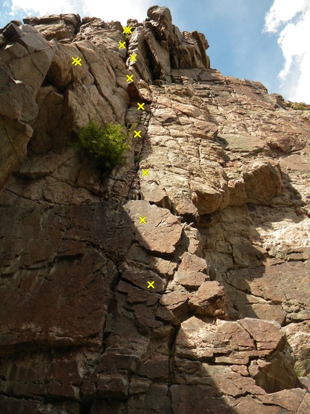 The main bolt line in the photo is Feelin' All Right. The anchor to the left of the bolts is for Horn of Plenty and the chains and anchors further right on the wall are for Search and Rescue.