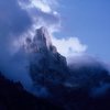 Cima della Madonna in the Pala Group, with swirling clouds characteristic of that area.