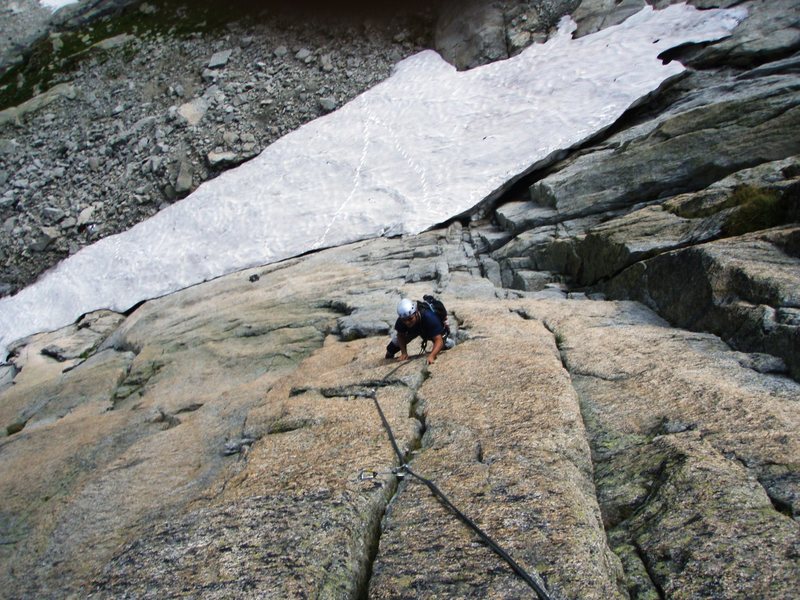 Splitter crack on pitch two of Mangolyto - note also the steep snow at the base of the climb, referred to in the route description. we left the boots at the first bolt.