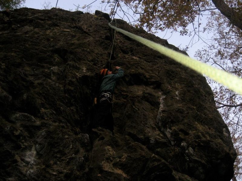 crackheadNH on a lower standing platform on the 5.8 Crack By The Road(actually 5.7) at Rumney