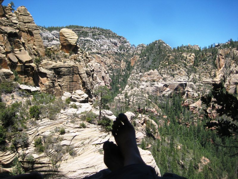 my wife kickin' back on picnic ledge at the end of pitch 3, taking in the view of Call of the Canyon.