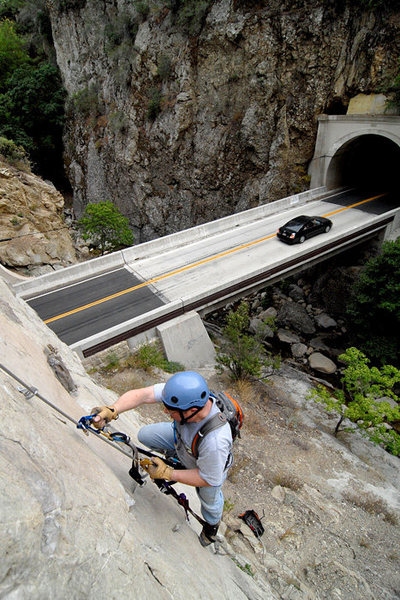Not just anther day of sport climbing: after being rained off of the Black Wall, further up the highway, David utilizes a fixed rope at Wheeler Gorge to practice his ascender technique.