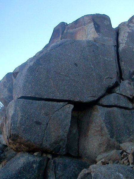Fear Wall? Great crack traverse with a couple stiff moves up and onto a ledge. Continue up crack and dont hesitate.