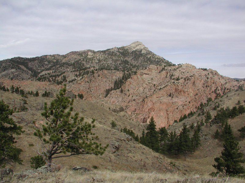 The Split Rock Summit from Toni Ridge with an outcrop of Reese Mtn Granite where the orange rock occurs.