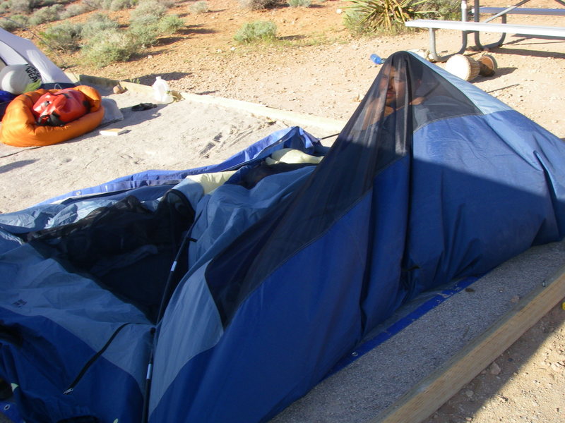 Greg in his tent after a particularly windy night at the campground.