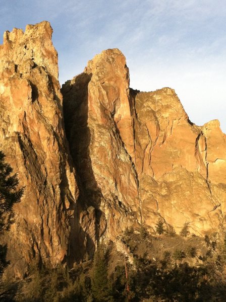 Smith Rock Group, NE Face. Freedom is on the Pillar climber's right of the large gully. The crux arete is clearly visible on the right side of the tower at two third's height.