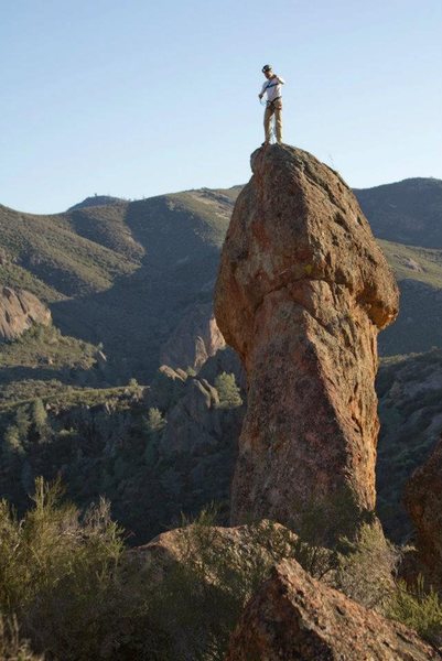 Photo of a climber on top.