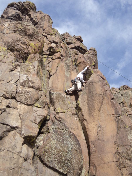 Mark Hudson making the fun reach for the arete hold.