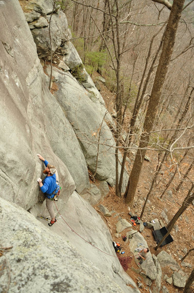 Moving out onto the face above the crack start. Photo by Monty