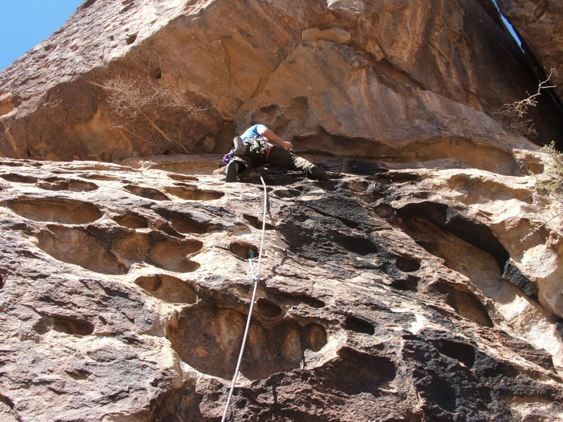 Lead climbing at Hueco Tanks to the utter amazement of the college boulderers.