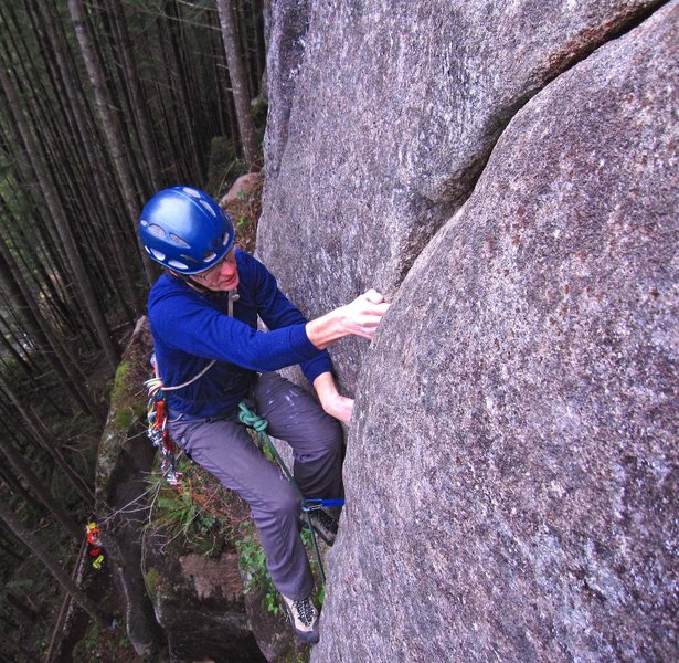 Eric Hirst getting established over the roof on Baby Tapir (5.11a).