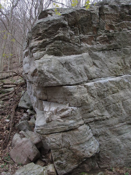 Sit start on the lowest ledge. Climb arete to the tricky top directly over arete corner.