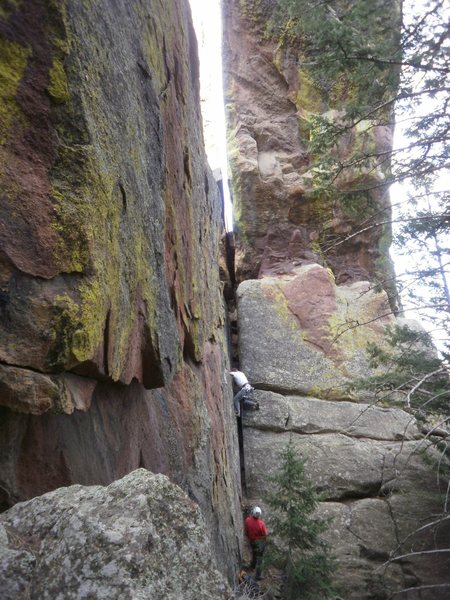 All the descriptions mention starting on the North side, but if you start around the South, you get a little extra squeeze chimney at the bottom and you can see your partner (while belaying).  Maybe this spot is loaded with poison ivy in the summer??  Didn't notice any now....