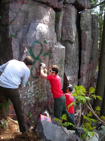 Hoofers crew making an attempt to clear the graffito on the "Hole In The Wall' formation on 4-22-12.  It was not successful and further efforts will be required.