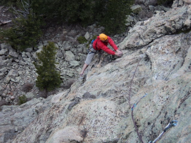 Dave enjoys the easier climbing above the start of P1.<br>
<br>
This pitch is probably 90 feet long. Also, an 80 foot rappel gets you to the ground from the P1 anchor.