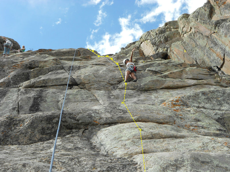 Bolts and route for Phipps' Garden.<br>
<br>
Left-facing dihedral where approach trail reaches bottom of cliff.<br>
<br>
Climbers in upper left are at anchors for "Madeira Beach" and "Safari Winch Ride."