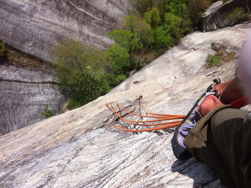 looking down while hanging off huge jugs partway up the stellar and very juggy second pitch.