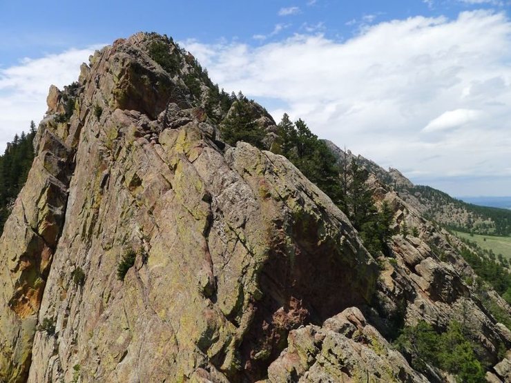 ...and another view of the unknown climber nearing the top of Rewritten.
