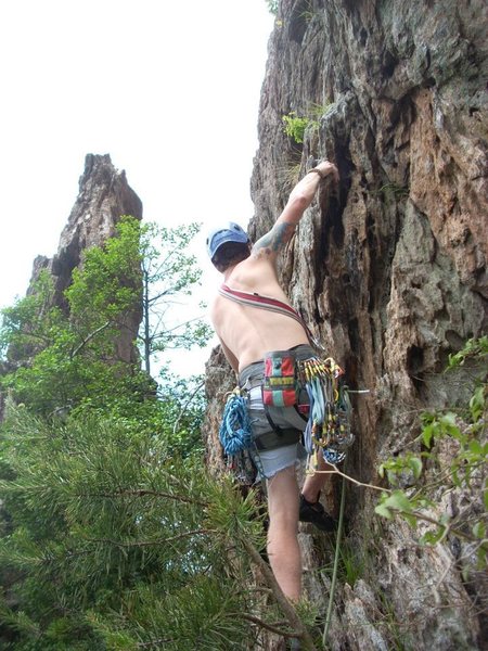 Kenny Johns leads Two Pitch(5.4) with Pinky Pillar in the background.<br>
<br>
Crowders Mountain State Park, North Carolina