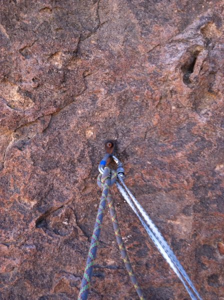 The one bolt at the ledge on top of P1. Belay can be backed up with a few smaller cams.
