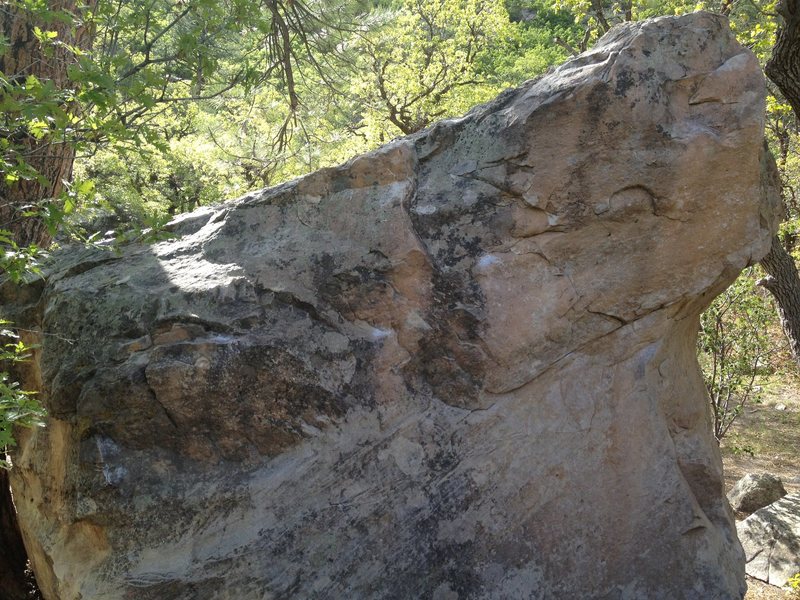 An overview with the problem beginning to the far left. The top out goes up the right arete.