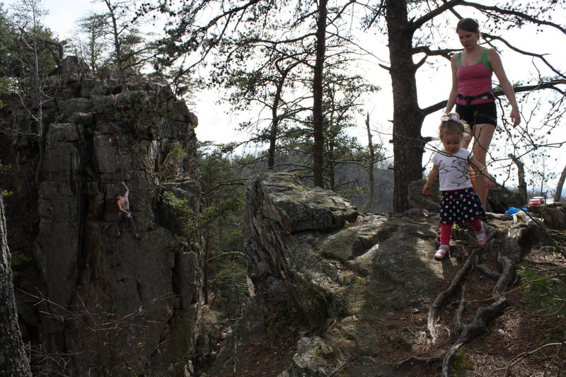 Fortress Wall<br>
<br>
Ryan Stokes climbs as Nicole and Ava stroll.<br>
<br>
Crowders Mountain State Park, North Carolina