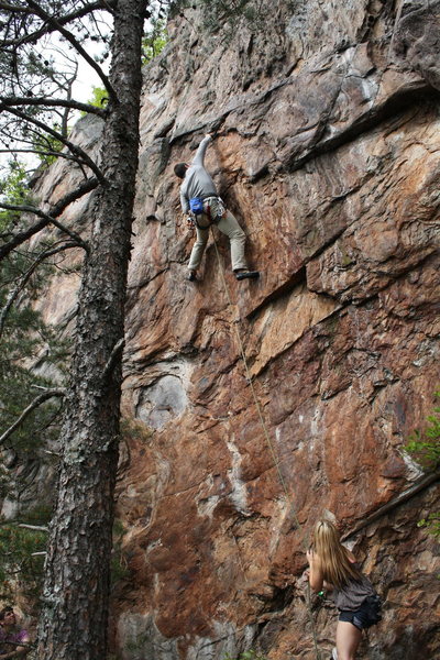 Rawlhide Wall<br>
<br>
Garrett DeBruin snags the undercling pinch on the crux of <br>
<br>
Disgustipated (5.11) sport<br>
<br>
Crowders Mountain State Park, North Carolina