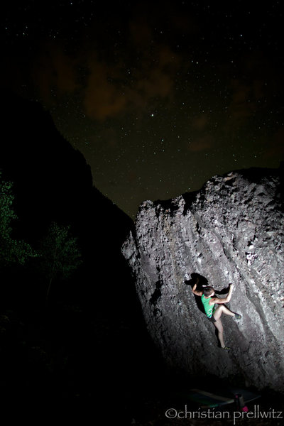 Erika Curry-Elrod enjoying the sculpted pockets of 'Every Hole's A Goal' (V2) under a starry summer sky.<br>
<br>
Photo by Christian Prellwitz