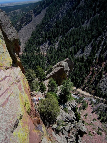 "You climbed where?"<br>
Kat A. scopes out the traverse to the first belay, viewing the runout with caution. March 2012 photo by Tony B.