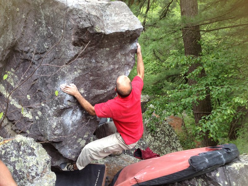 Mike squeezing up the arete