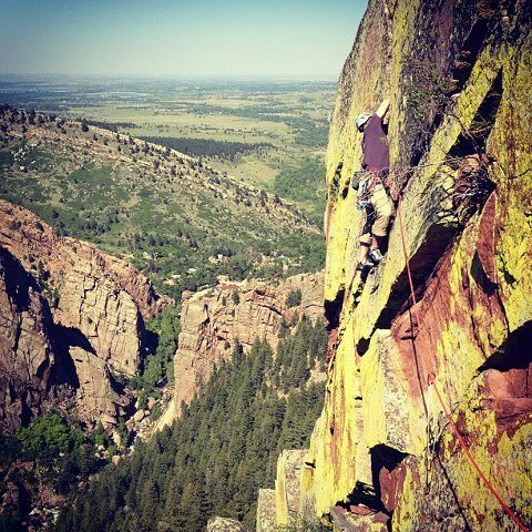 Mike leading pitch four of Heavy weather on a glorious may afternoon in Eldo..
