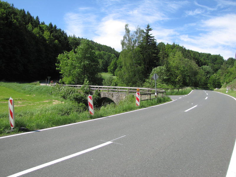 Here is your left turn over the bridge and then park on the right where the person in the picture is standing.